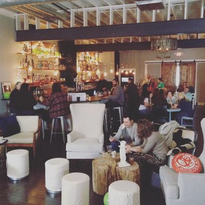 Guests sip cocktails, share bites and conversation in the elegant bar at Breathe Cocktail Lounge.