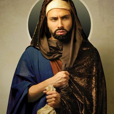 A man in medieval-style clothing and headwear.