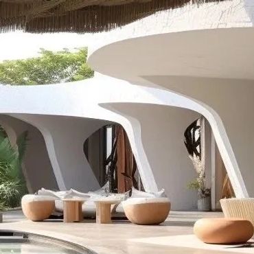 Modern outdoor seating area with unique curved white architecture and round wooden stools.