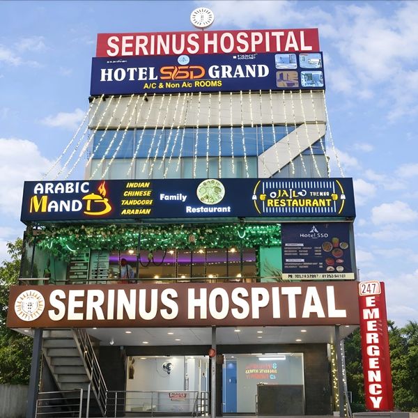 Multi-purpose building with Serinus Hospital and various restaurants.