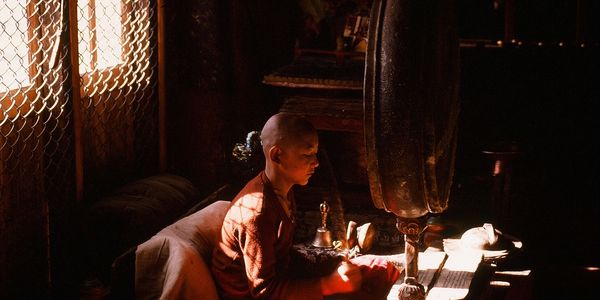 photo of young Himalayan monk working in a Buddhist gompa in Ladakh