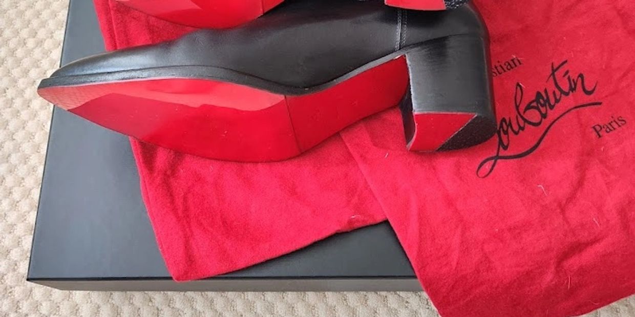 Christian Louboutin Is Taking His Red-Soled Shoes and 'L