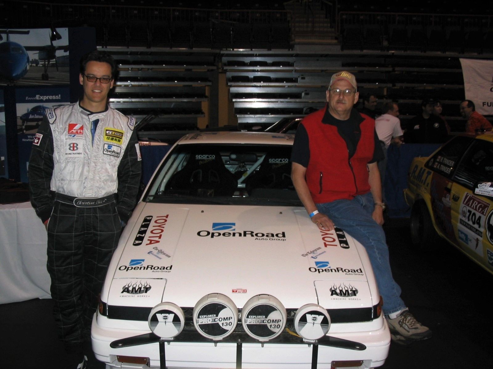 Rally crew chief and driver at car show