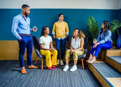 Group of people chatting at work