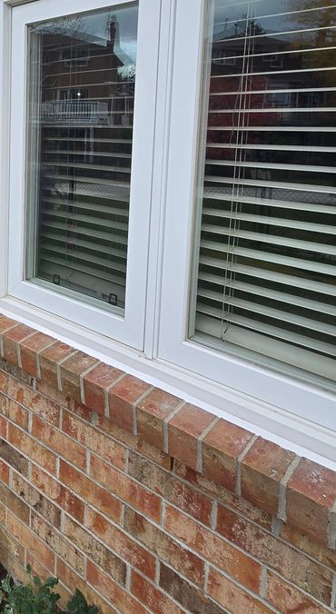 Silicone sealant applied around window.