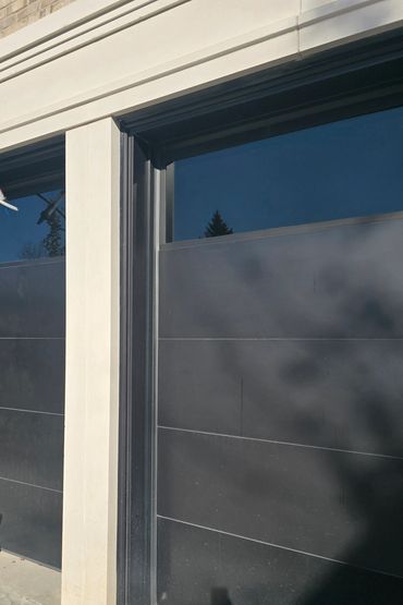 Sealing perimeter of garage door frame.