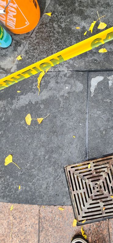 Sealing granite joint & drain.