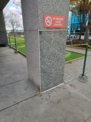 Professional caulk bead was applied to granite joints on column for this commercial office building.
