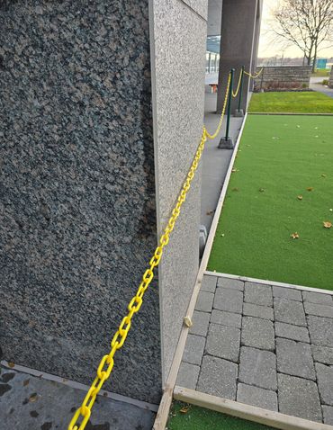Caulking granite column returns.
