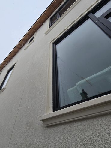 Caulking services were provided for this custom home, sealing the joint from window to substrate.