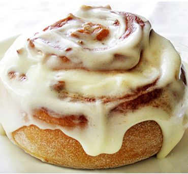 Cinnamon bun with gooey cream cheese frosting