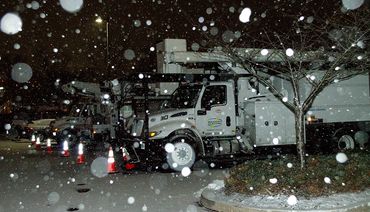 snowy bucket trucks