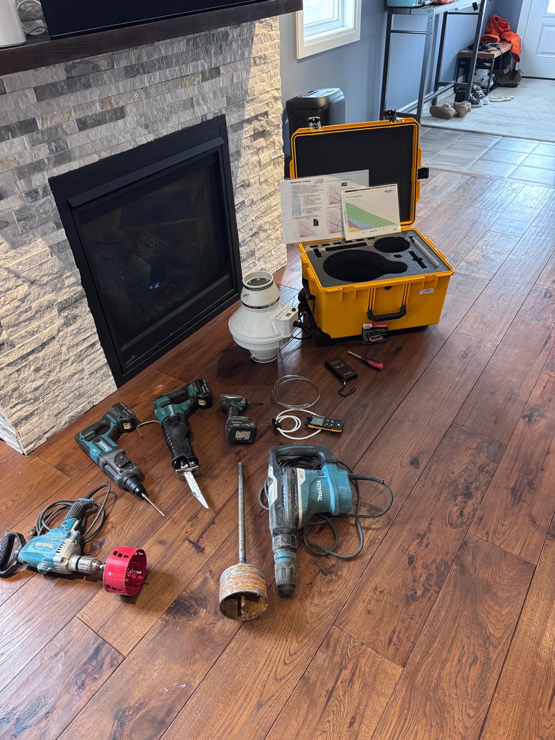 “Professional radon mitigation tools  Makita drills  Fantech fan system setup  radon reduction