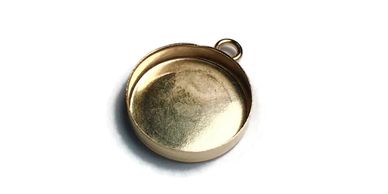 A small, round, empty gold pendant with a loop for a chain.