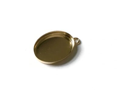 Small oval gold pendant tray with a loop for attaching to a necklace.