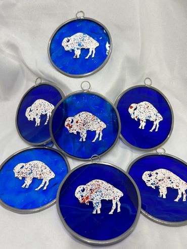 4" round blue stained glass ornament with an etched and painted buffalo