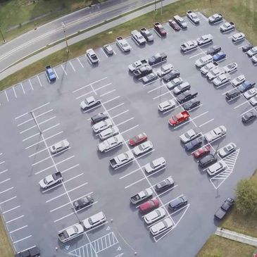 Local golf course parking lot. Recieved prep work, crack repairs, sealcoat and parking lot markings.