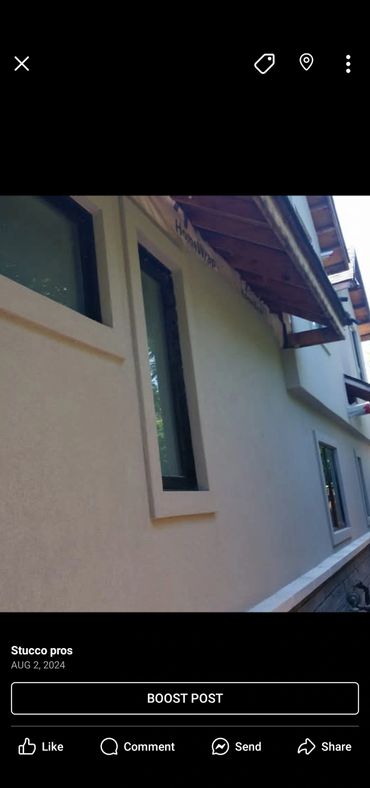 Smooth stucco exterior with modern windows on a residential building.