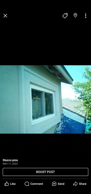 Freshly applied stucco around a window on a house exterior.