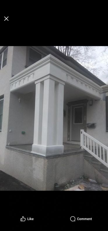 White porch column with decorative molding on a house entrance.