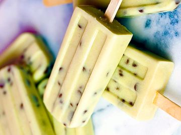 Pistachio popsicles with nuts inside.