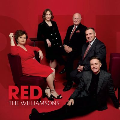 Family portrait of the Williamsons with a red theme.