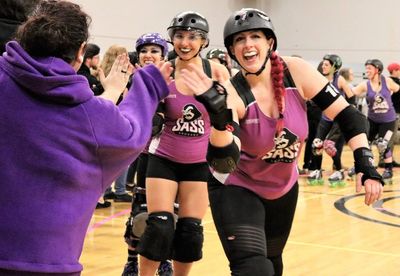 Ultra Violent and Chi-Hulk high five fans after a game. 