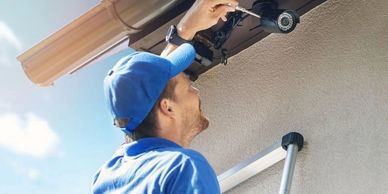 Technician installing Security camera