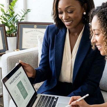 Two women discussing a tablet display.