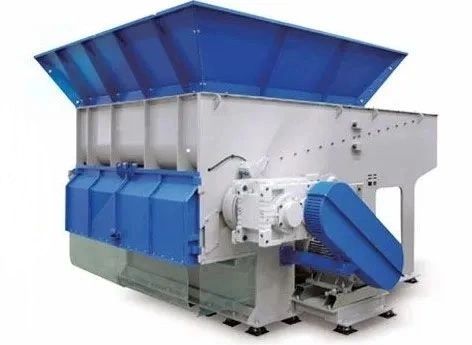 Large industrial shredder machine with blue and gray components.