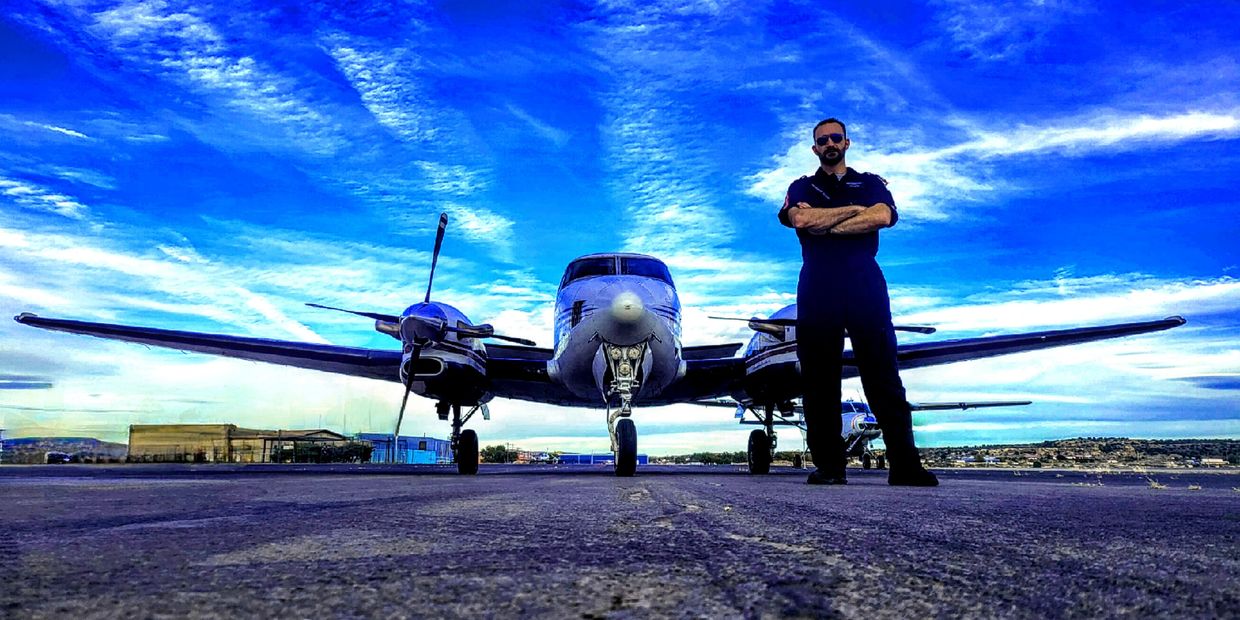 Joseph Quilter standing in front of a Beechcraft king air