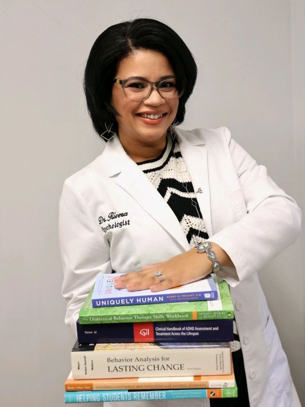 Dr. Rivera is holding her favorite resources.