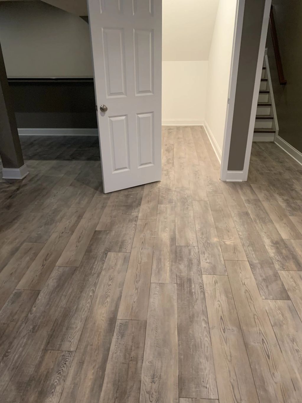 Vinyl flooring installation, Avon basement.