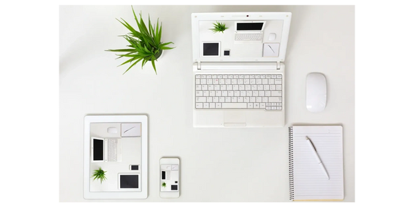 Organised workspace with laptop, tablet and phone