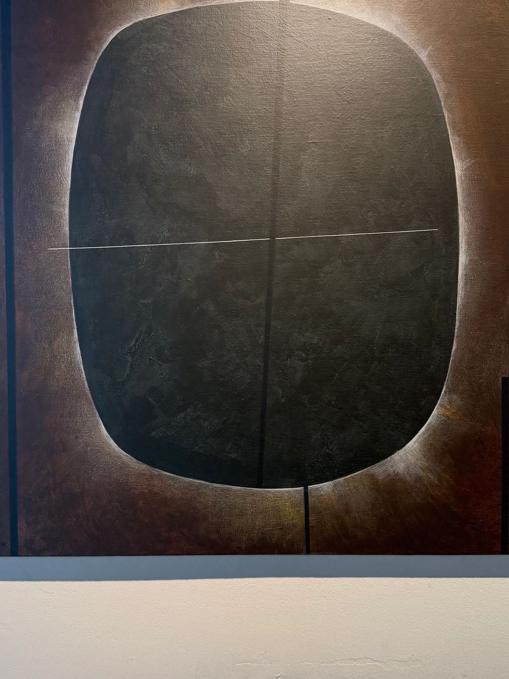 Abstract painting with dark rounded shape and thin white line.