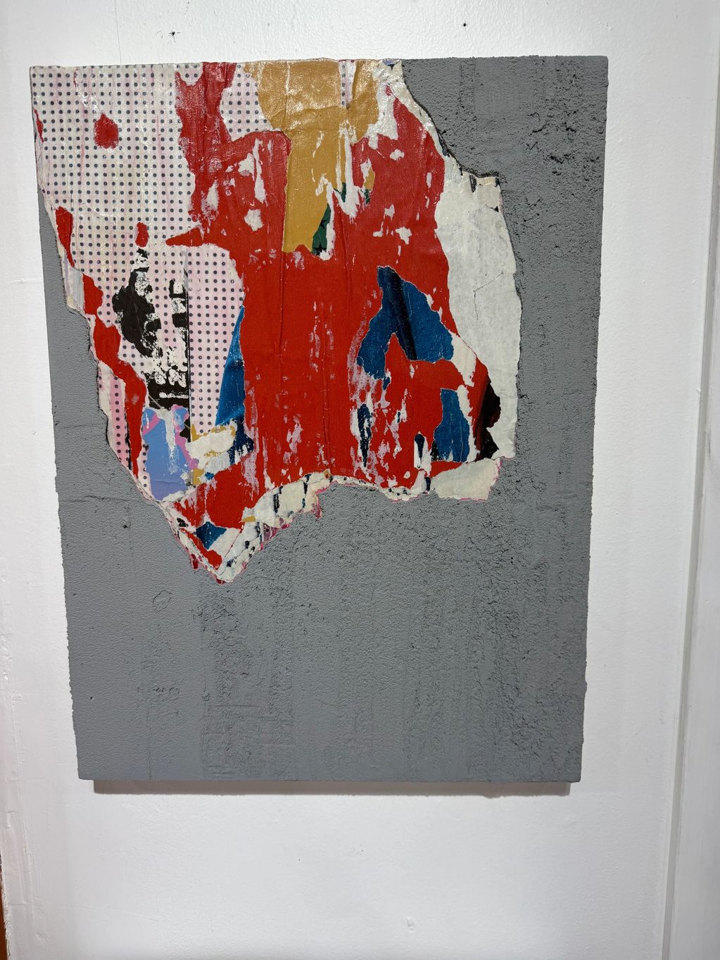 Abstract mixed media artwork with bold colors and textured grey background.