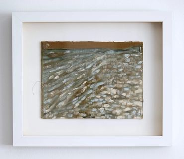 Abstract painting with textured strokes in a white frame.