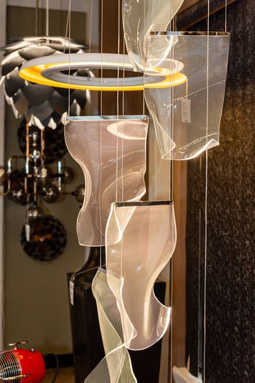 The Rinkle pendant from ET2 features sheets of transparent acrylic, shaped by hand, and lit by LED. 