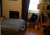 Back bedroom of the apartment (with tenant's belongings in picture).