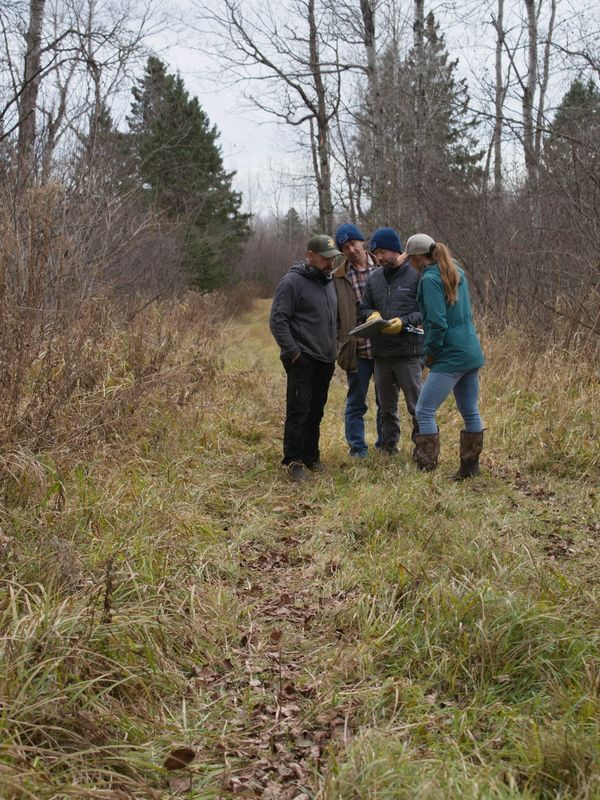 Carlton SWCD Staff on a site visit with a Carlton County landowner.