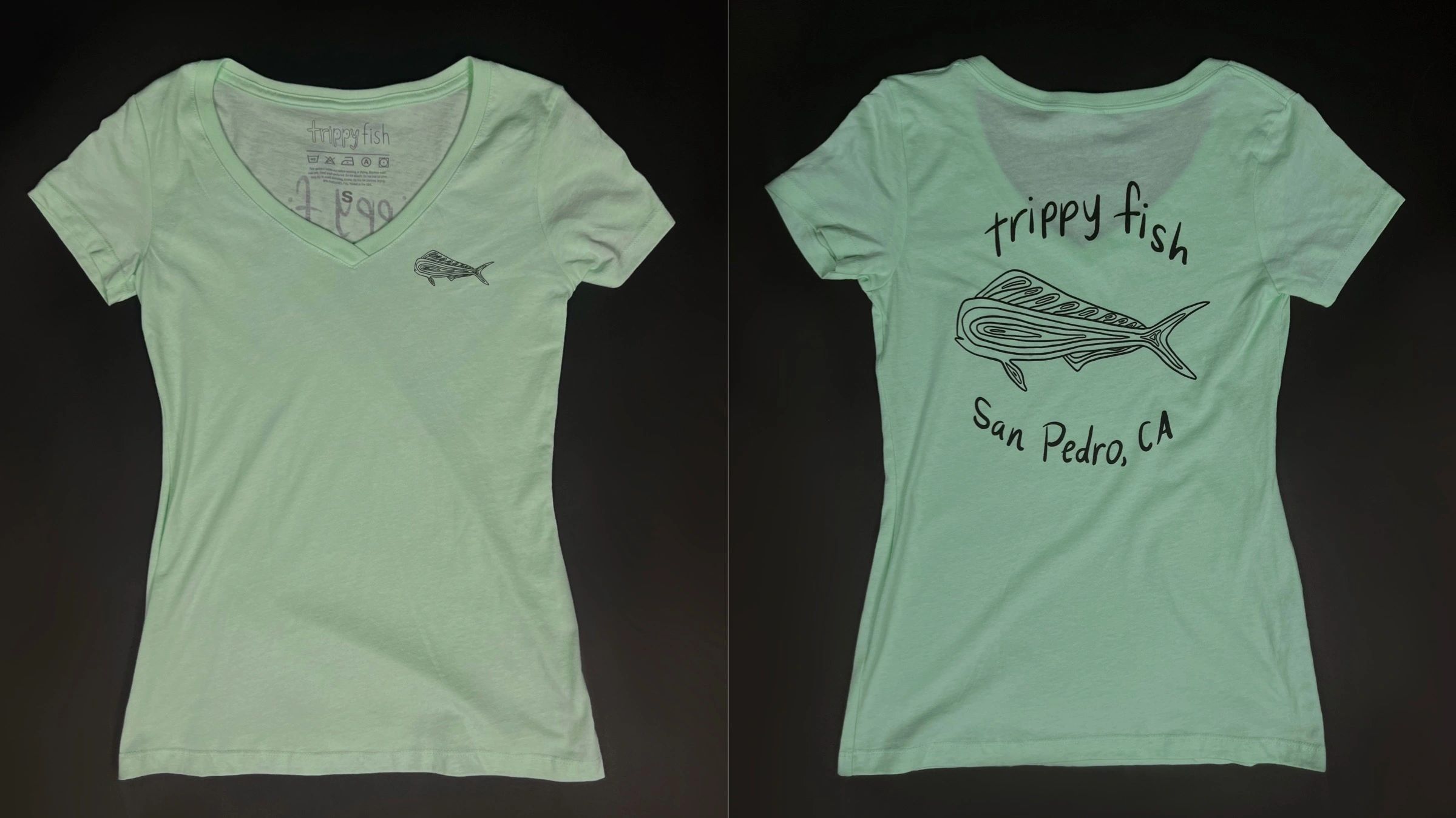 green v-neck t-shirt with a Dorado fish logo and the word "trippy fish San Pedro, CA"