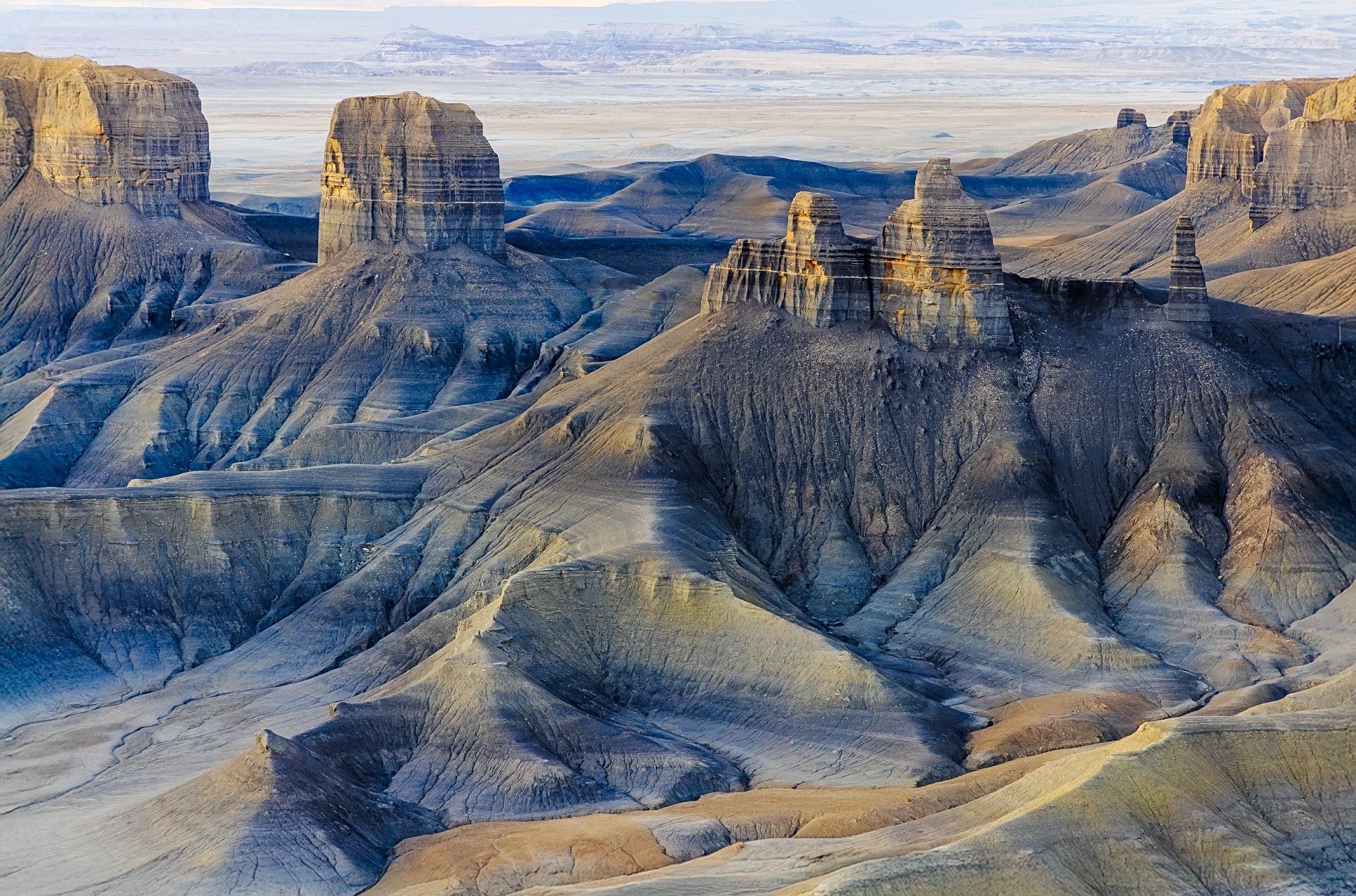 Eroded rock formations in a desolate landscape.
