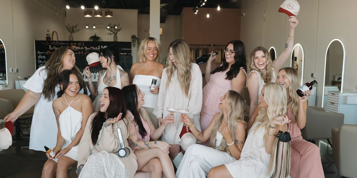 The Social Salon & Co team posing together inside the salon.