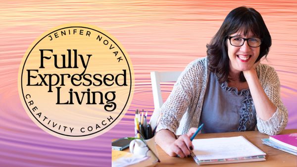Creativity coach Jenifer Novak smiling while writing at a desk.