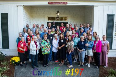 Group photo of Cursillo #197 participants outside Wooden Hall.