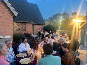 Outdoor evening dinner party with friends and family.