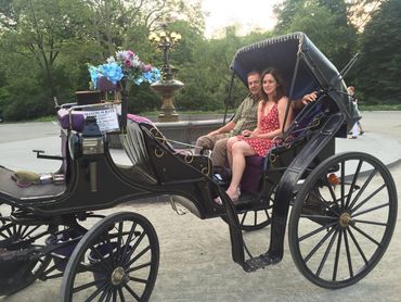 Happy couple takes a ride with Troy Carriages