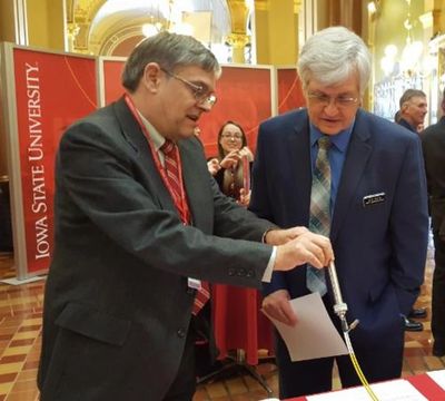 Dr. David Laird demonstrates company's soil nitrate sensor to State Representative Jeff Kurtz in the