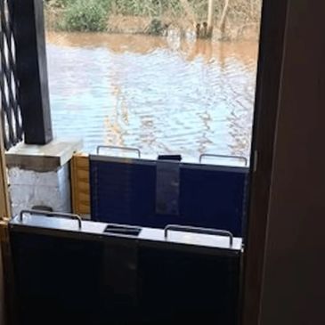 Flood barriers installed at doorway to prevent water entry during flooding.