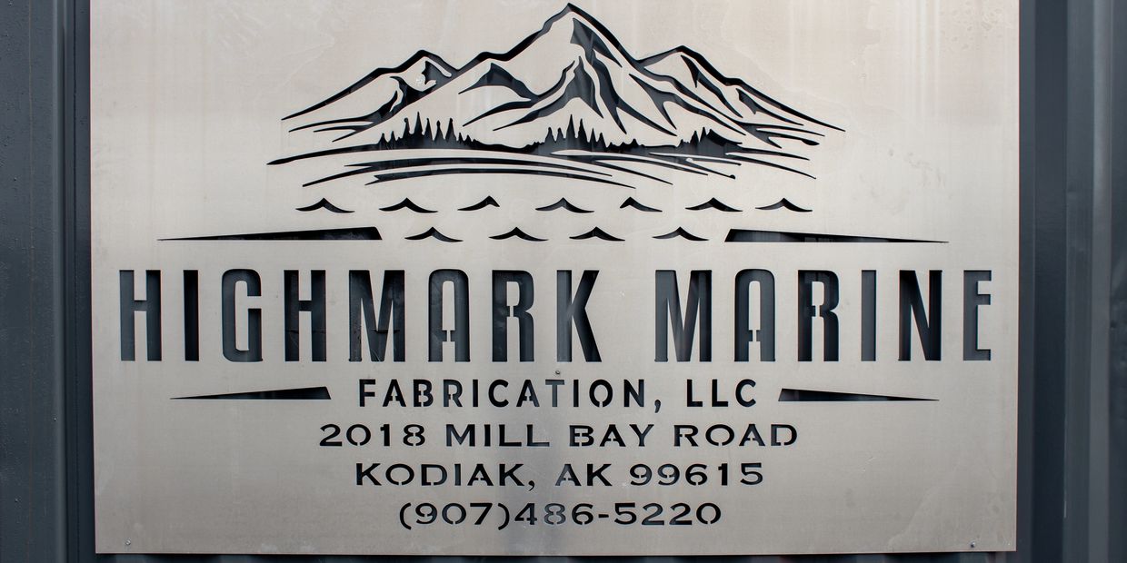 aluminum sign depicting Highmark Marine's logo and contact information.